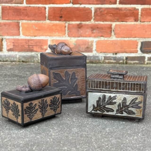 Three lidded boxes