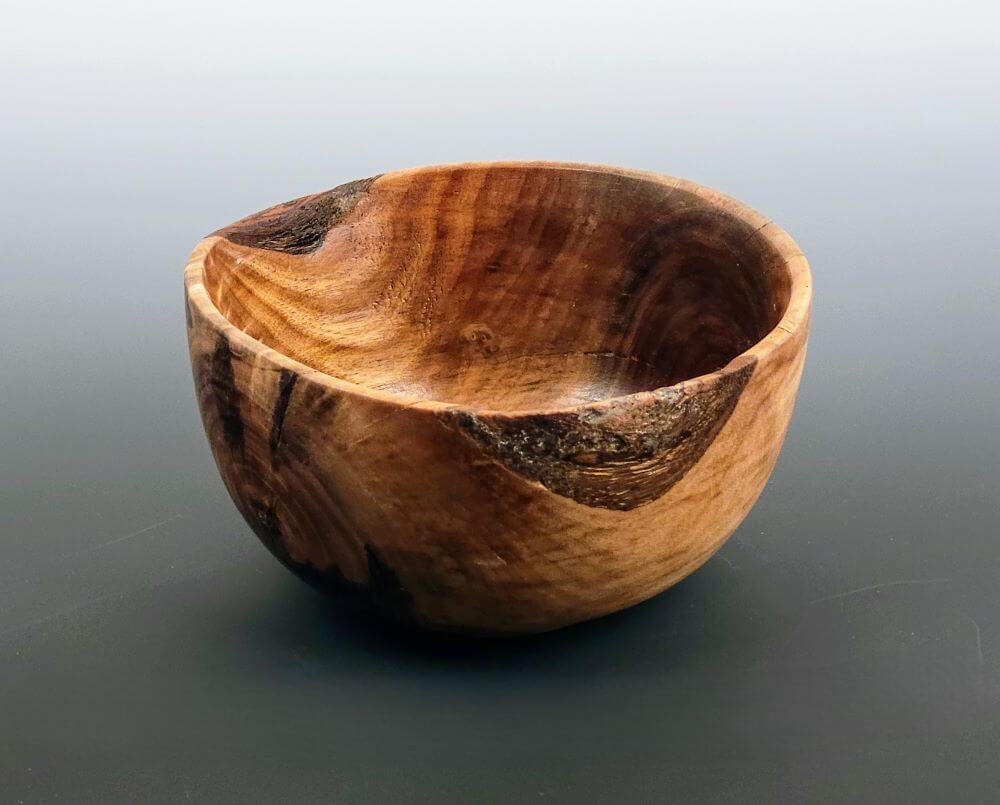 Bowl with partial natural edge