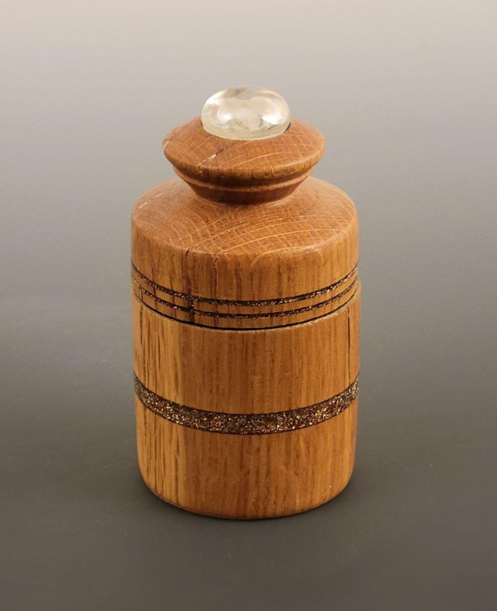 Lidded oak vessel with glass cabochon