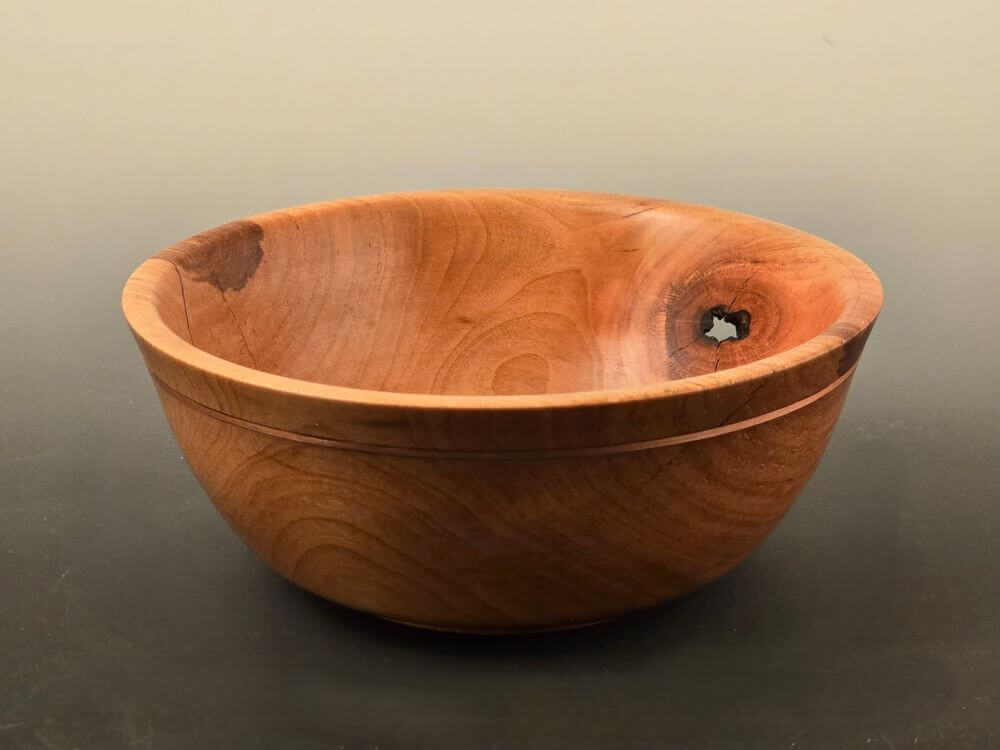 Maple bowl with copper ring and natural flaw